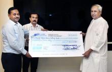 Odisha State Beverage Corporation handing over a cheque of Rs 5 Crore to Chief Minister Shri Naveen Patnaik towards CMRF at Lok Seva Bhawan